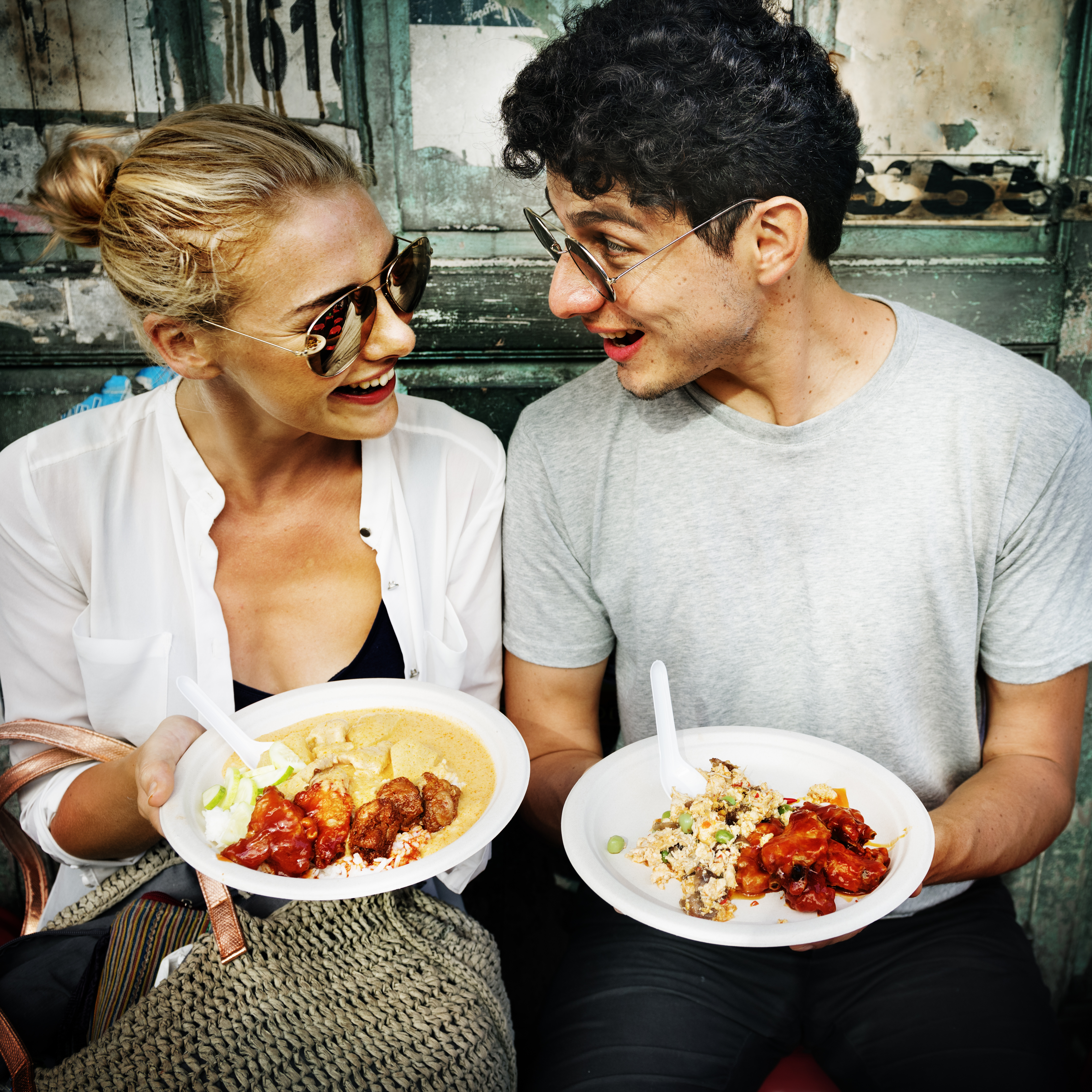 IGOGEER - Couple Traveling eating Asian food